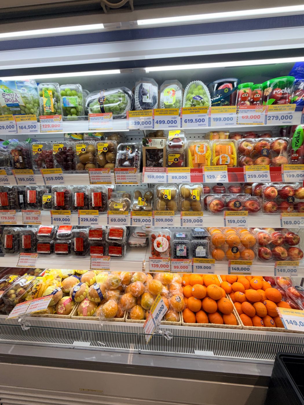 The produce aisle at the local grocery store with price tags in another currency